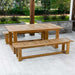 Westminster Teak Horizon Teak Dining Picnic Set on a deck with benches and table beside landscaped planters