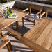 Westminster Teak Horizon Teak Dining Picnic Set on a patio with drinks and an extendable table leaf for flexible outdoor dining