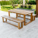 Westminster Teak Horizon Teak Dining Picnic Set on an outdoor patio with greenery, shrubs, and a scenic lake backdrop