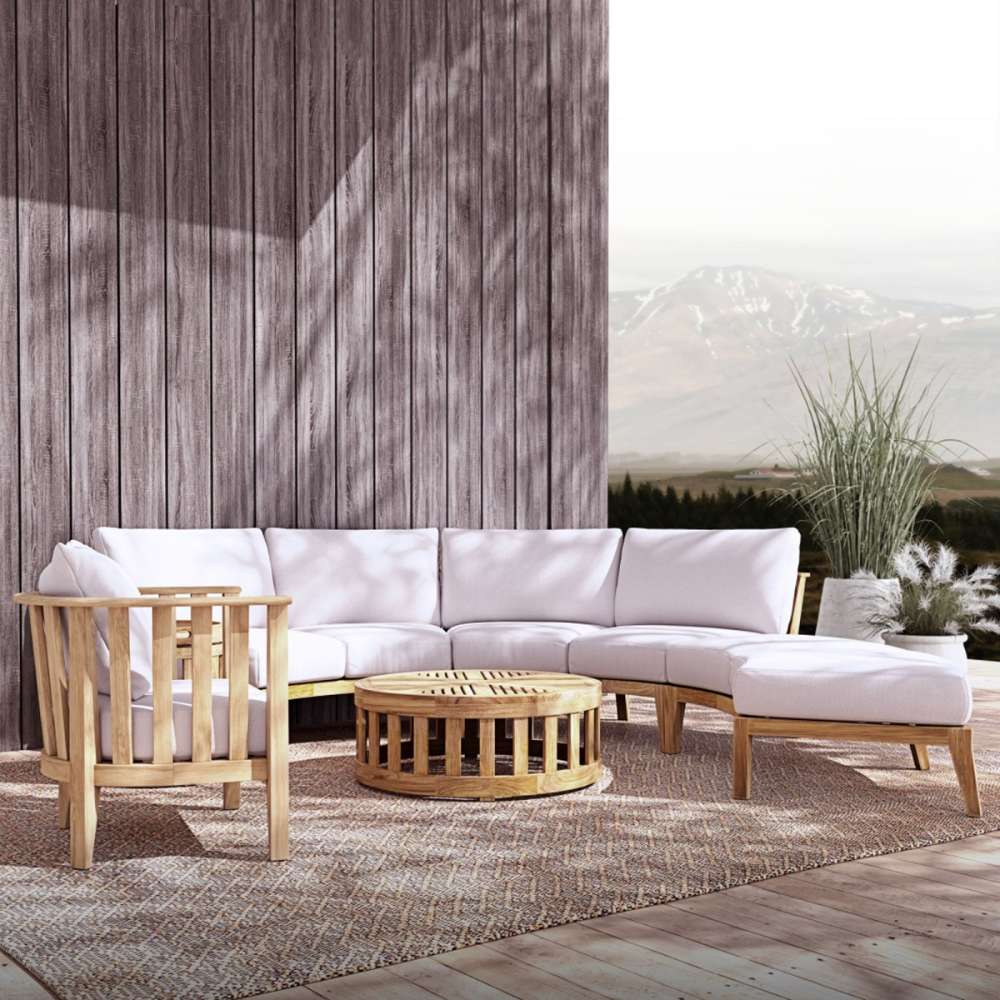 Westminster Teak Kafelonia 6pc Sofa Sectional Set on an outdoor patio with pale cushions, teak tables, and mountain views