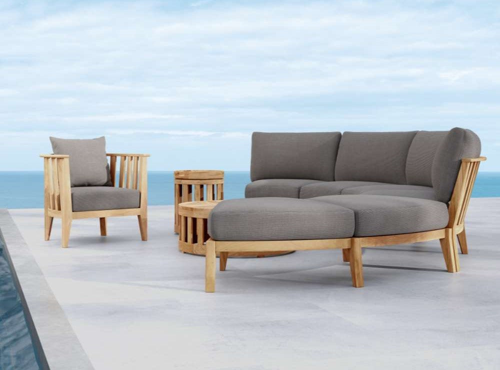 Westminster Teak Kafelonia 6pc Sofa Sectional Set with gray cushions lounge chair and tables on a patio