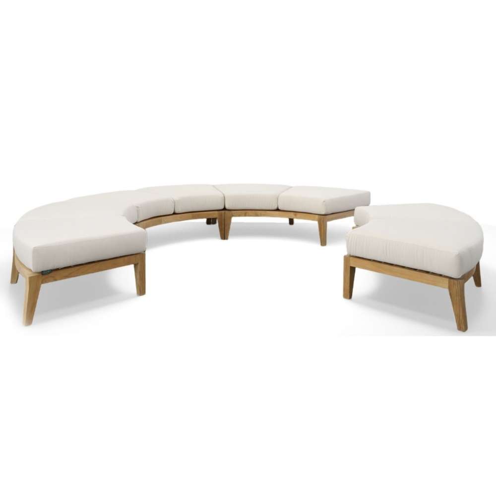 Westminster Teak Kafelonia Backless Sofa Sectional paired with a matching curved ottoman creates a flexible outdoor seating layo