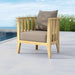 Westminster Teak Kafelonia Club Chair on a poolside patio with beige cushions, coastal plants, and an open sky backdrop