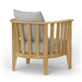 Westminster Teak Kafelonia Club Chair with a rounded slatted back, natural teak finish, and gray cushions in a rear angle view