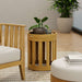 Westminster Teak Kafelonia Side Table used indoors as a teak accent table with a plant and candle