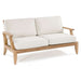 Westminster Teak Laguna Sofa is shown at an angle with cream-colored cushions, emphasizing its clean lines and sturdy wooden frame