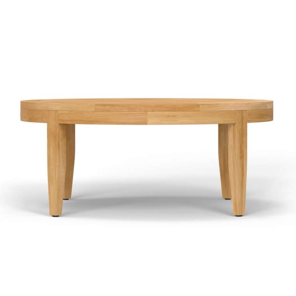 Westminster Teak Laguna Teak Coffee Table is shown in a low profile view, emphasizing its wide circular shape and solid wood construction