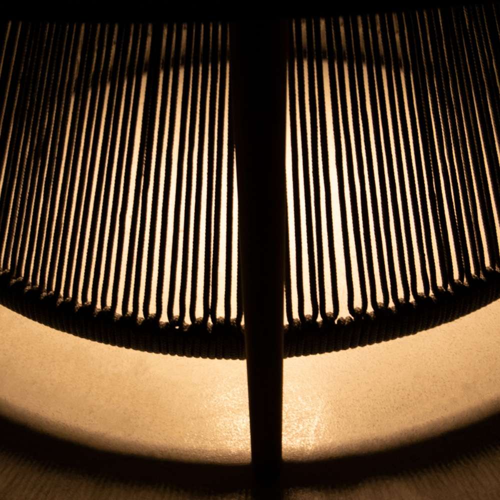 Westminster Teak Luna Coffee Table close-up with light glowing through the rope base