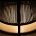 Westminster Teak Luna Coffee Table close-up with light glowing through the rope base