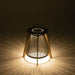 Westminster Teak Luna Large Lantern glows warmly in the dark, casting soft, radial light patterns through its vertical rope design onto the surrounding surface