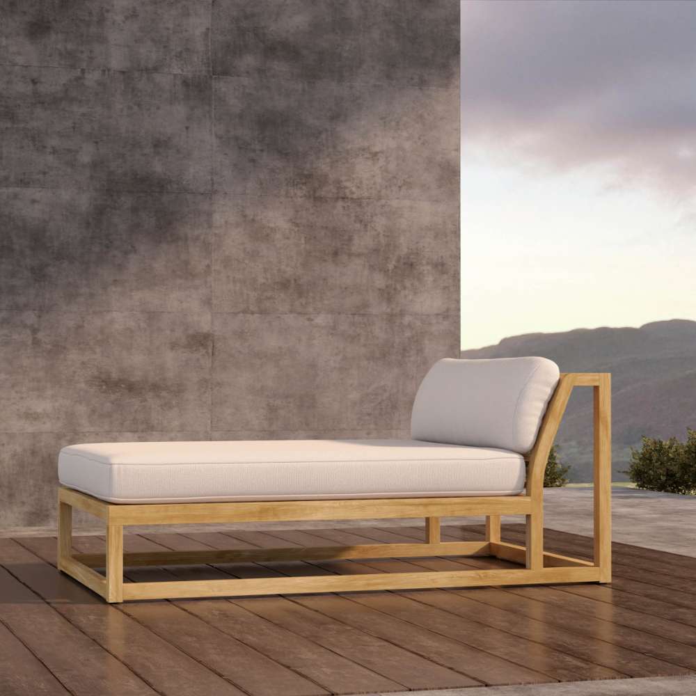 Westminster Teak Maya Chaise highlights a side view with a long cushion and angled backrest on a teak frame set on a wooden deck with mountain views