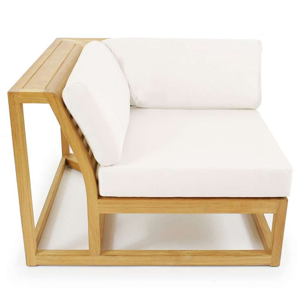 Westminster Teak Maya Corner Sectional with cushions is shown from the side, highlighting its low profile, supportive back cushion, and smooth teak armrest