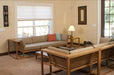 Westminster Teak Maya Right Side Sectional arranged indoors with matching seating, cushions, and tables in a cozy living room