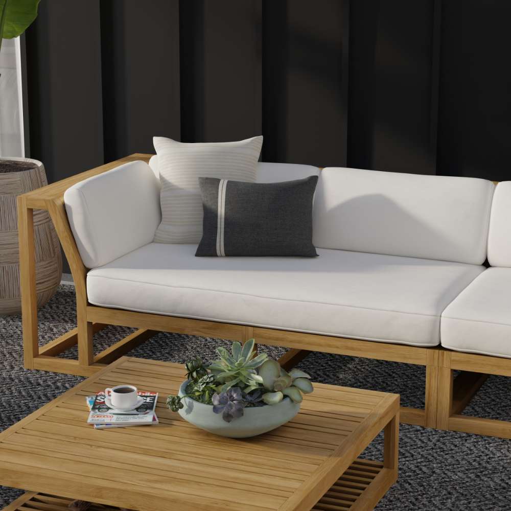 Westminster Teak Maya Right Side Sectional styled on a patio with neutral cushions, teak table, and decorative accents