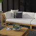 Westminster Teak Maya Right Side Sectional styled on a patio with neutral cushions, teak table, and decorative accents