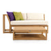 Westminster Teak Maya Right Side Sectional with cream cushions, colorful pillows, and matching teak coffee table in a cozy setup