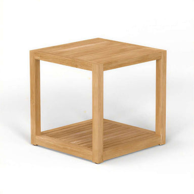 Westminster Teak Maya Teak Side Table is a square teak side table with a solid top, open sides, and a lower slatted shelf, shown at an angle on a plain light background