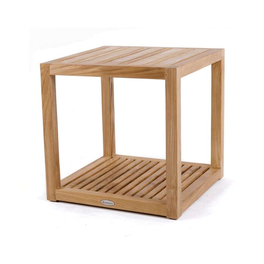 Westminster Teak Maya Teak Side Table is pictured from above as part of a matching outdoor lounge set, placed in front of seating and topped with a bowl of green apples