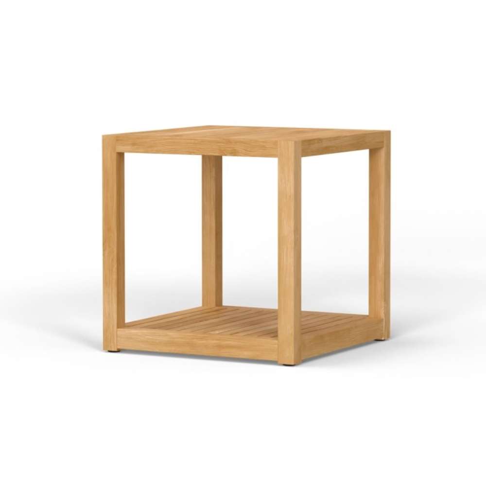 Westminster Teak Maya Teak Side Table is shown from another angled view, highlighting its boxy teak frame, smooth square top, and slatted bottom shelf