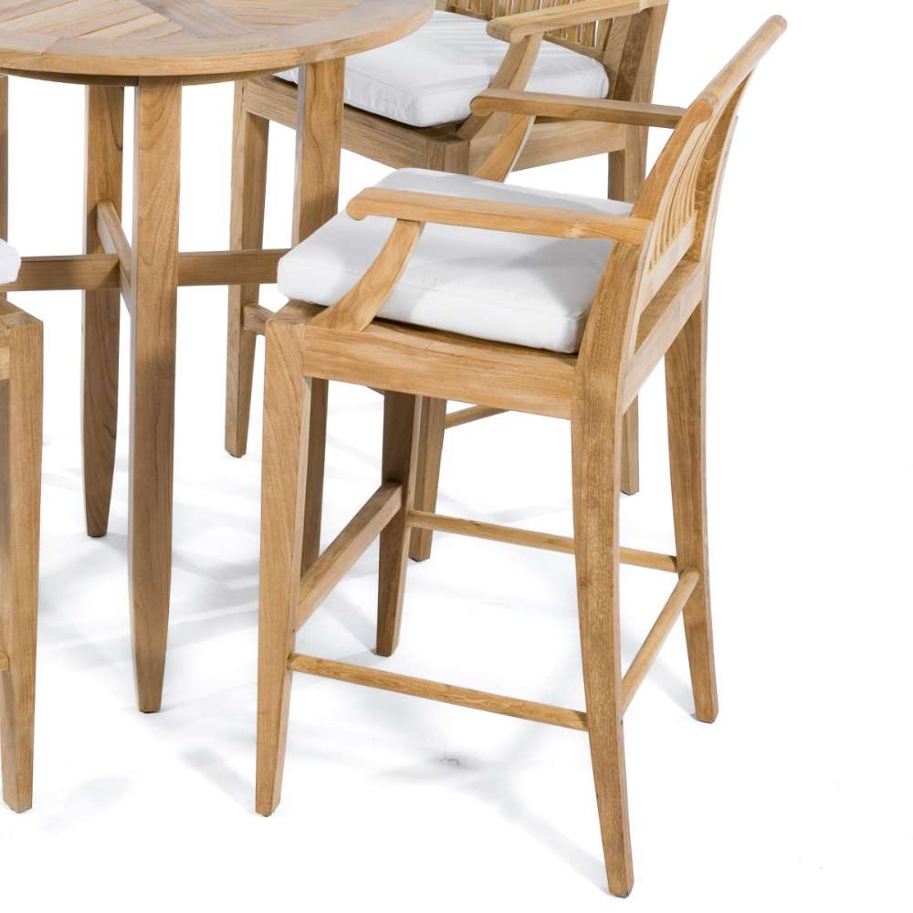 Westminster Teak Somerset Backless Bar Stool with white cushions beside a matching teak table
