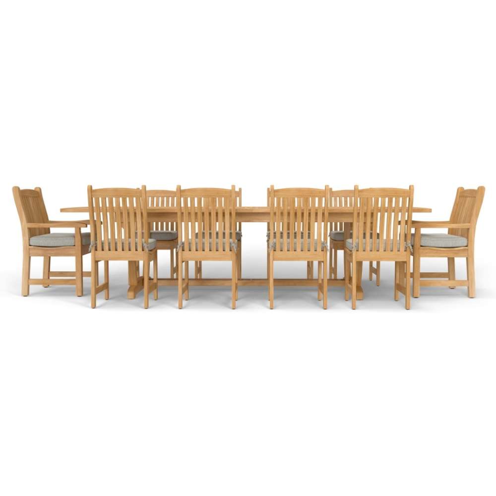 Westminster Teak Veranda 11pc Teak Dining Set long teak dining table with matching chairs and cushions aligned in a straight side profile