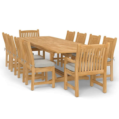 Westminster Teak Veranda 11pc Teak Dining Set with a full arrangement of teak table and chairs with cushions in a clean side view on a white background