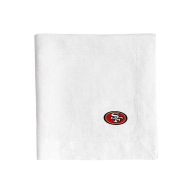 White Crate & Barrel European Flax-Certified Linen Napkin, Set of 4 with an embroidered San Francisco 49ers logo near the lower right
