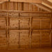 Wide view of a wooden shed interior shows multiple empty Outdoor Living Today 8ft Western Red Cedar Shed Shelves (Set of 3) mounted neatly along the wall