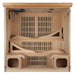 With the front wall removed, Golden Designs Monaco Near Zero EMF Far IR Sauna reveals slatted heating panels, a two-level reclining bench and footrests