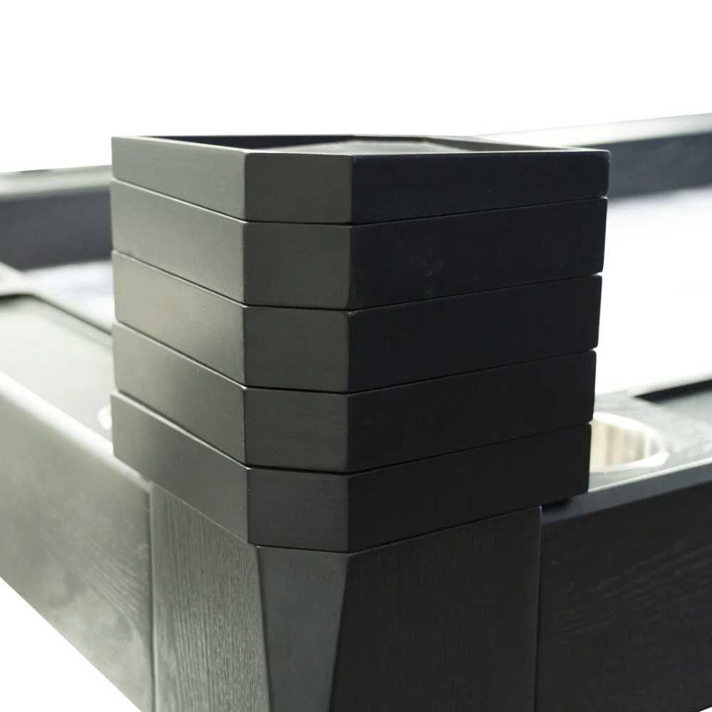 With a minimalist approach, the Game Theory Tables Tiered Tray shows a compact stack of sleek black trays