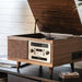 With a vintage wooden design, the Crosley Serenade 8-In-1 Record Player - Walnut features a lifted lid revealing a vinyl turntable and built-in speakers