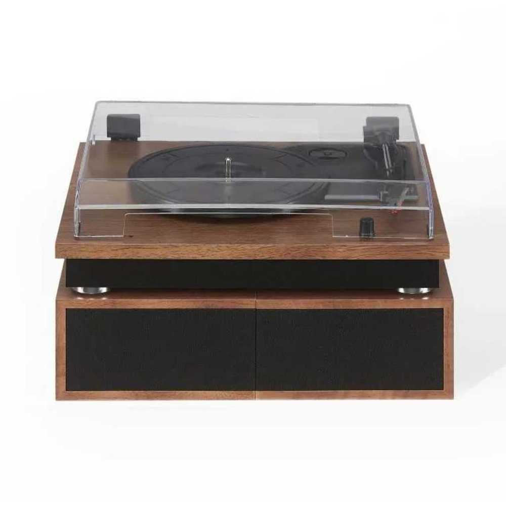 With the dust cover closed, the Crosley Riff Record Player With Speakers - Walnut presents a sleek design with both speakers stacked beneath the turntable