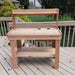 Wooden bench sits on a deck with a simple design and lower shelf, with Outdoor Living Today 4×2 Western Red Cedar Potting Bench at the center