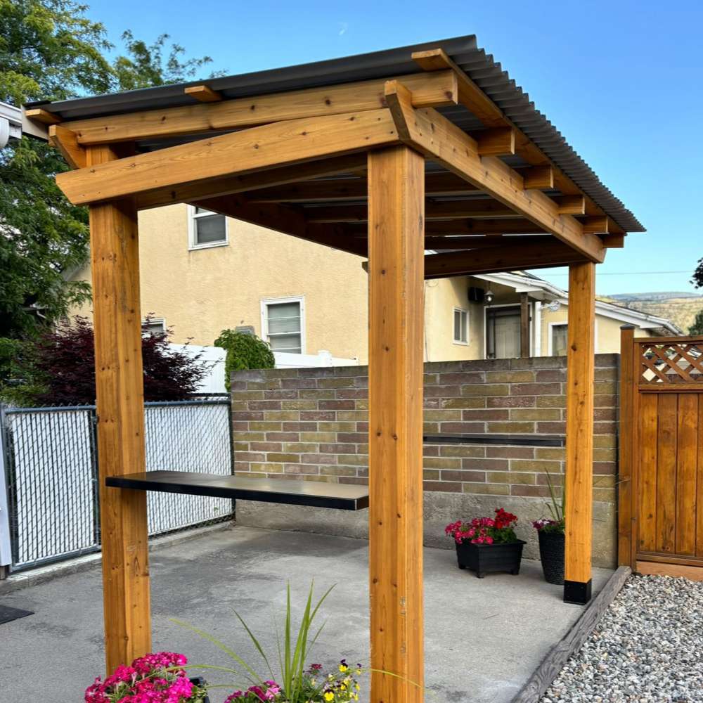 Wooden patio shelter with a metal roof and side shelf, the Outdoor Living Today Western Red Cedar 8x5 Grill Gazebo offers a sturdy outdoor grilling space