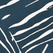 Zoomed-in detail reveals the ivory palm-like lines woven across the dark ink background of Couristan Dolce Indoor/Outdoor Rug - Parquet/Ink