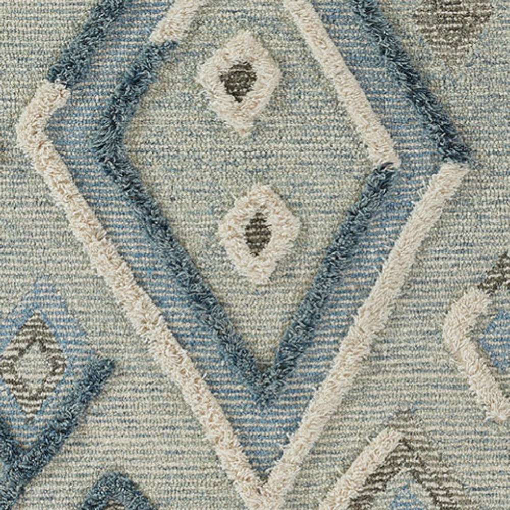 Zoomed-in image of Momeni Allegro Indoor Rug - ALL-1 Blue highlights the layered diamond motifs in soft blues and grays