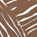 Zoomed-in section of Couristan Dolce Indoor/Outdoor Rug - Parquet/Amber reveals white organic lines resembling palm fronds on a warm amber base