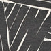 Zoomed-in view of Couristan Dolce Indoor/Outdoor Rug - Parquet/Charcoal reveals the intricate white-on-charcoal geometric lines