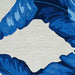 Zoomed-in shot captures the rich detail and layered texture of the Couristan Covington Indoor/Outdoor Rug - Palm Leaves/Blue in a leafy section
