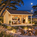 Lerum 44 sports room illuminated at night among live oaks, maritime pines, sea oats, and coastal dunes on North Carolina’s Outer Banks.