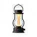 Black Crate & Barrel Balmuda LED Rechargeable Outdoor Lantern with a black body, metal carry handle and a central tube that guides the light downward