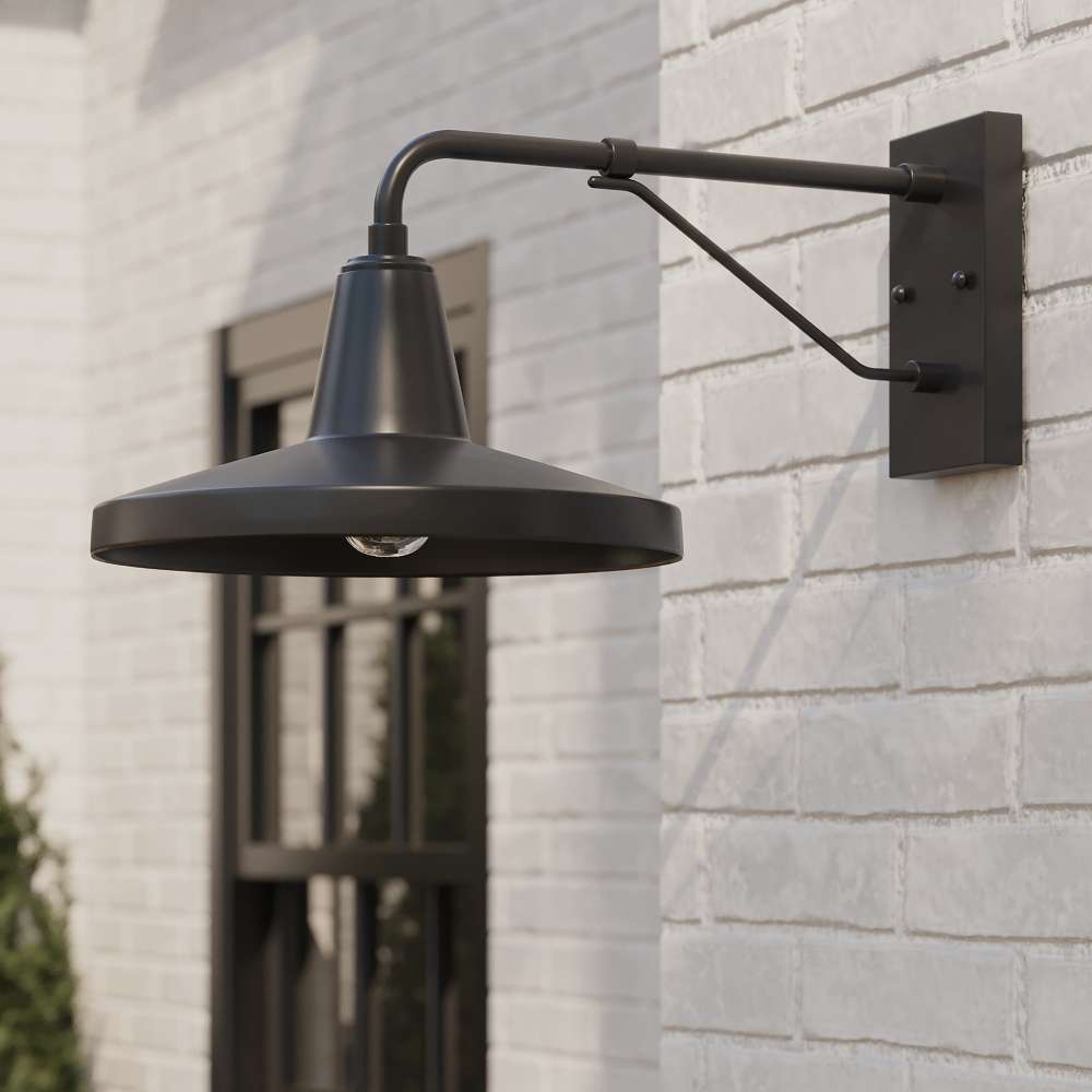 Black Crate & Barrel Mariner Outdoor Wall Sconce in a side view showing the wall plate and downward-facing shade
