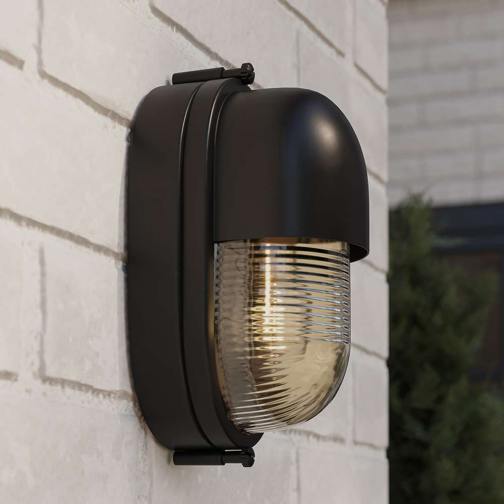Black Crate & Barrel Maritime Black Outdoor Wall Sconce in matte black solid brass with a fluted glass shade and a compact wall plate, shown in the first alternate view
