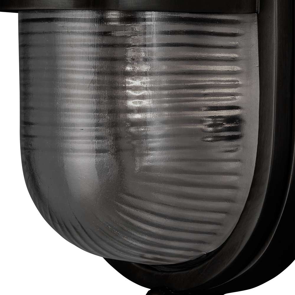 Black Crate & Barrel Maritime Black Outdoor Wall Sconce in matte black solid brass with a fluted glass shade and hardwired mounting plate, shown in the fifth alternate view