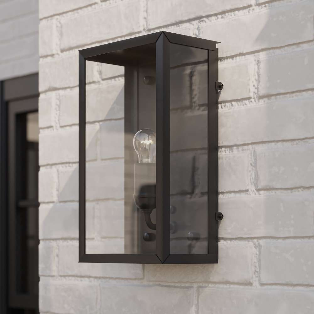 Black Crate & Barrel Royster Black Outdoor Wall Sconce in matte black solid brass with a hardwired mounting plate and open lantern frame, shown in the fourth alternate view