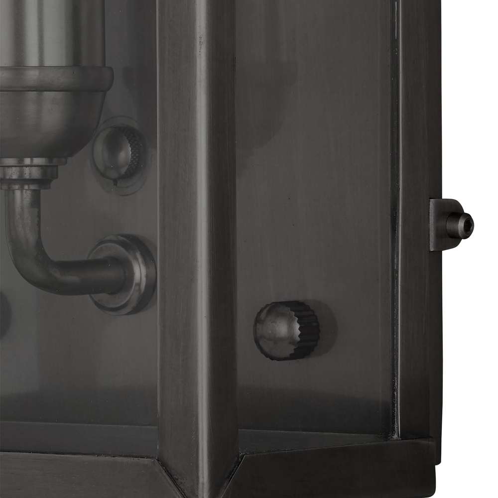 Black Crate & Barrel Royster Black Outdoor Wall Sconce in matte black solid brass with an antique cabinet silhouette and clear glass panes, shown in the third alternate view