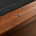 Black Crate & Barrel Walnut Pool Table with Wall Rack and Accessories in close up on the walnut rail with a small metal sight dot beside the black felt