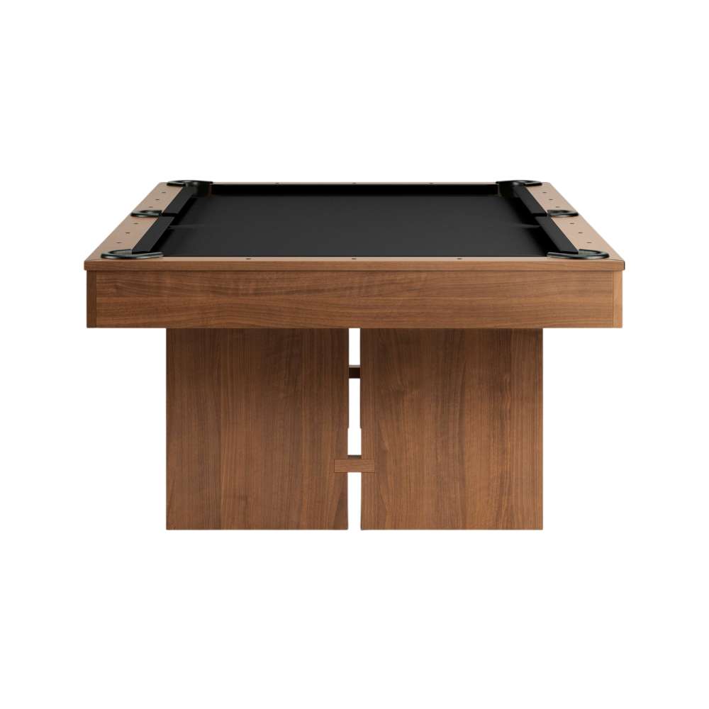 Black Crate & Barrel Walnut Pool Table with Wall Rack and Accessories seen straight from the end against a white background with black felt, the corner pockets and two slab legs
