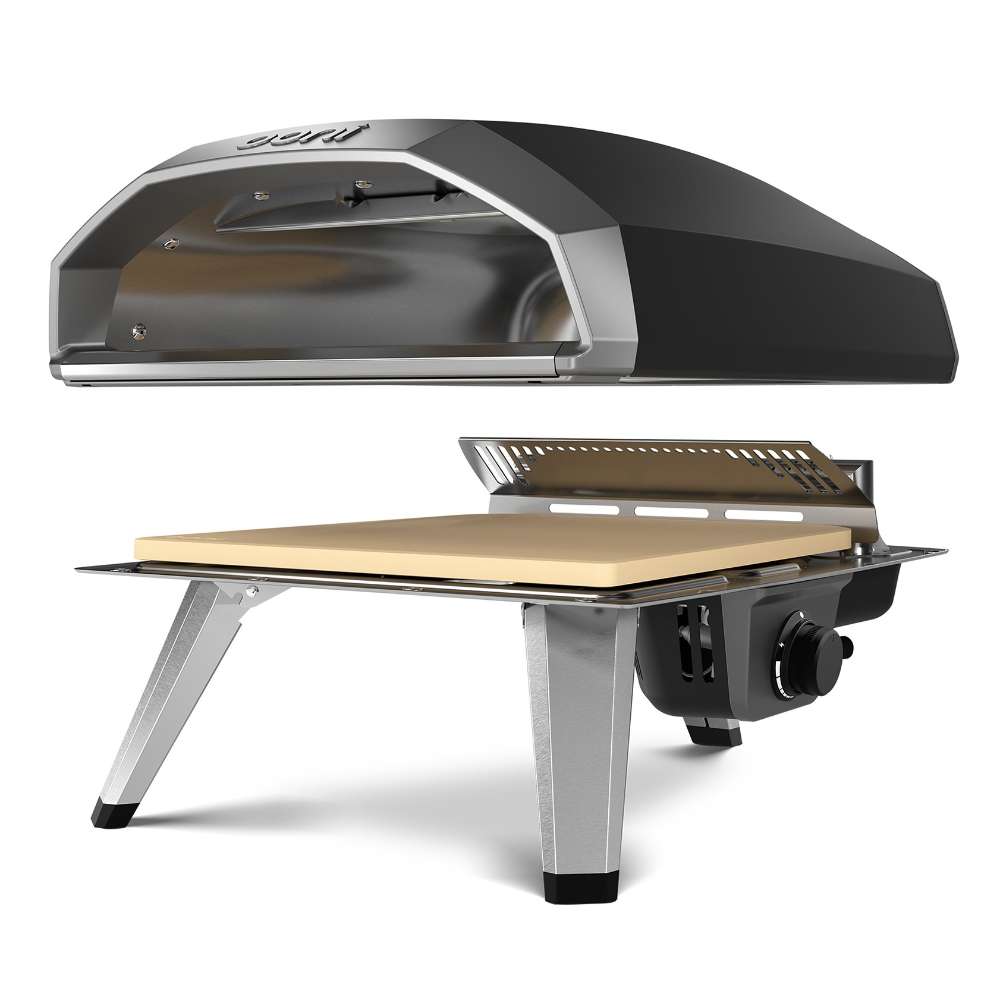 Black Ooni Koda 2 Pizza Oven exploded view with the shell above the burner grate the baking stone and the legs.