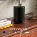 Black Sonos Era 100 Next-Gen Smart Speaker on a walnut sideboard beside books with the words Control your way and icons for Sonos App, Touch Controls, Apple AirPlay 2, Sonos Voice Control, Amazon Alexa and Direct Control